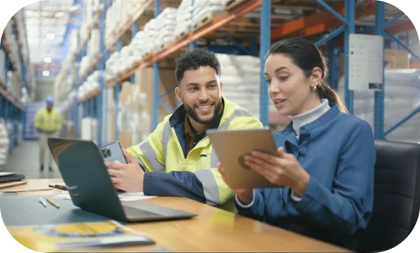 Maintenance team using CMMS software on tablet